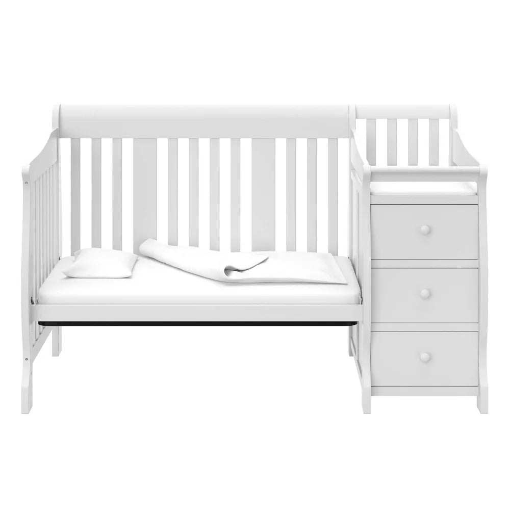 Cuna convertible 5 en 1 Storkcraft Portofino y cambiador (blanco): cambiador combinado con cajón, se convierte en cama para niños pequeños